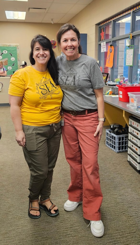 Two women with Sycamore Education Association t-shirts on.